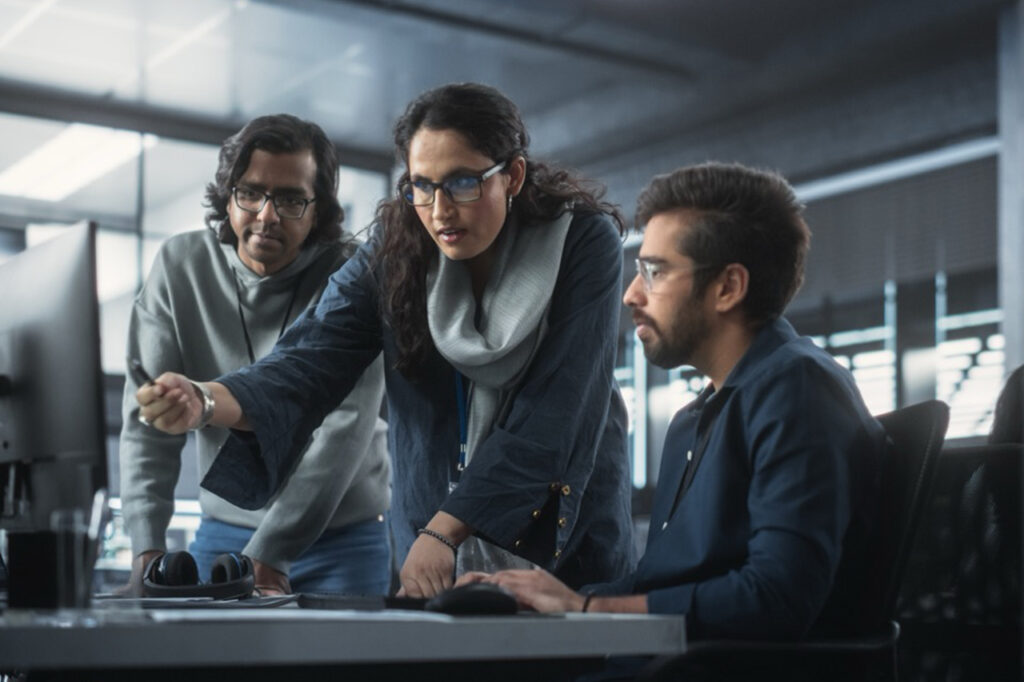 Female engineer with colleagues