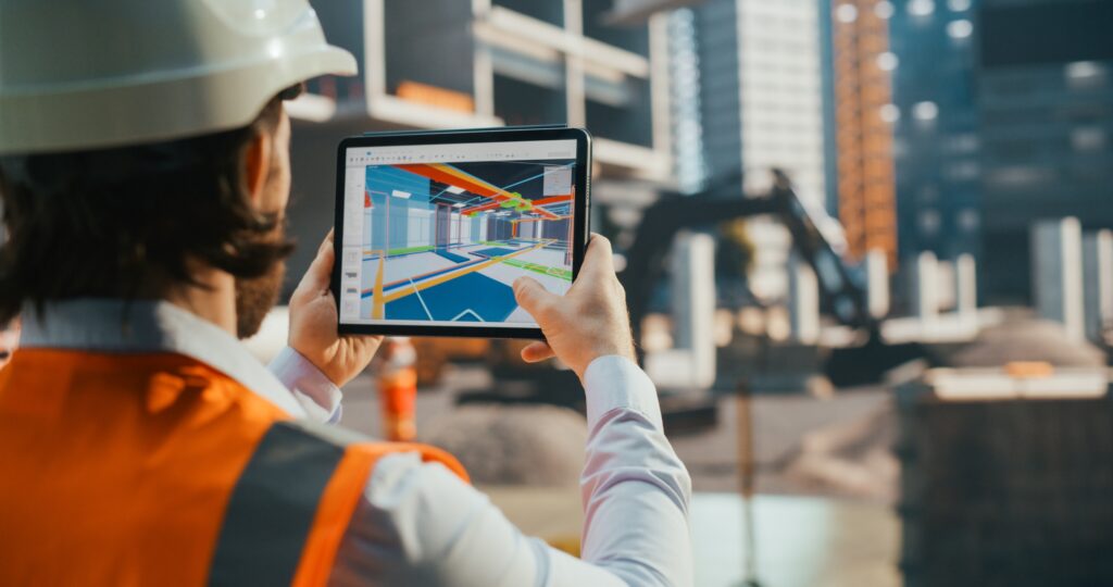 Industrial Engineer Inspecting a Residential Construction Spot with a Virtual Reality App with a Virtualization of the Building's Interior. Over the Shoulder Shot of an Architect Working on Site